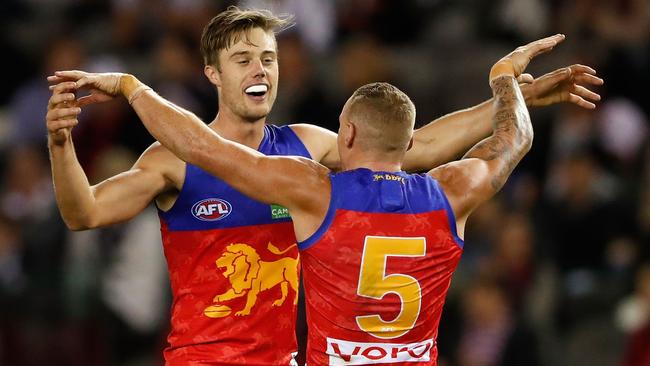 Josh Schache celebrates a goal with Mitch Robinson.