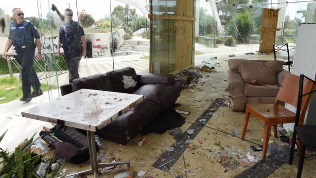 Police inspect the trashed Ecoville Community centre in Tarniet. Pic: Nicole Garmston.