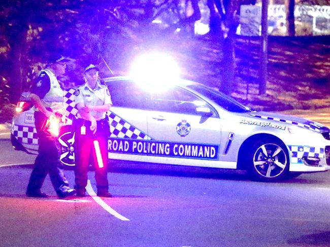 Police cordon off Brisbane Airport as an emergency situation is declared.  Picture: Steve Pohlner/AAP