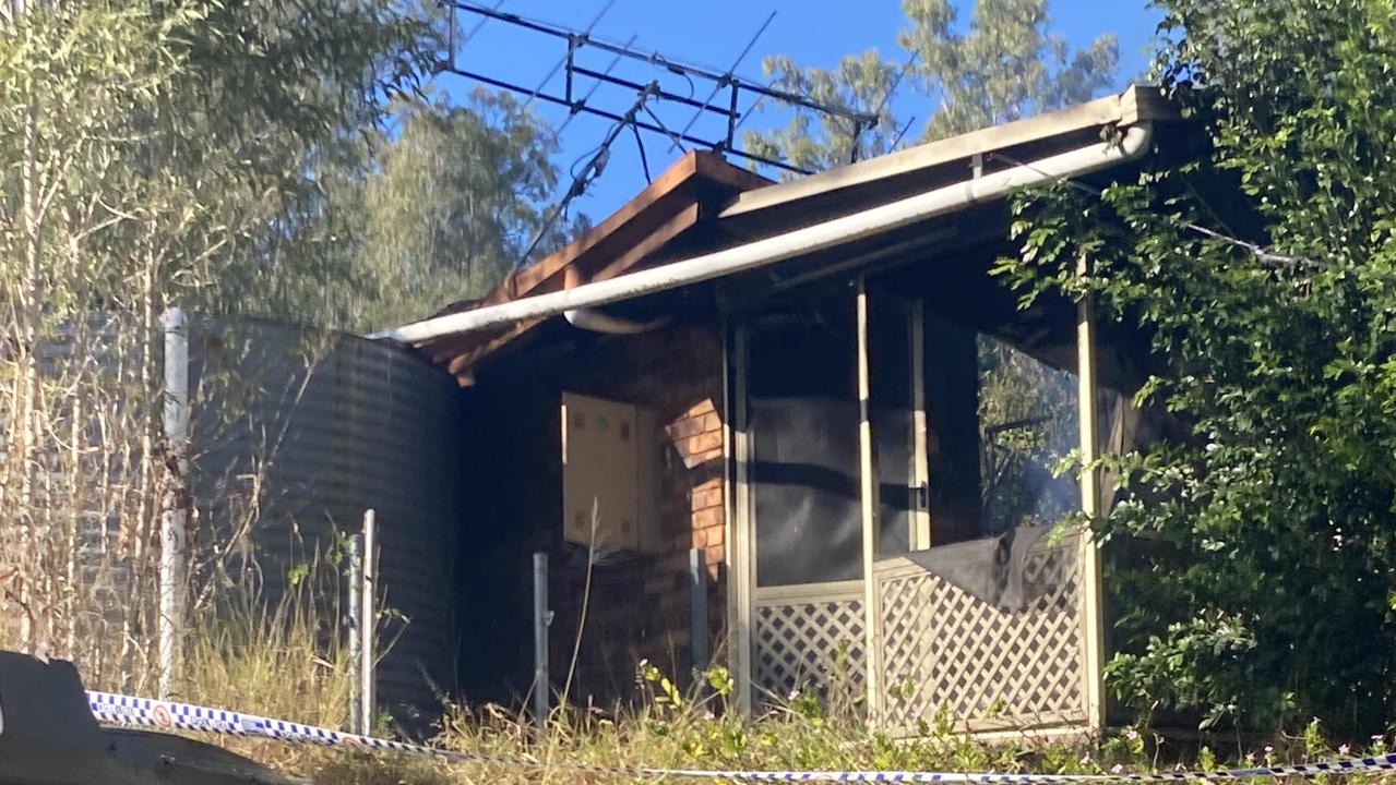 Kathy Moore, whose Woolooga home stands less than 10m from the building gutted by an overnight fire which claimed the life of a woman, said she felt “sick to her stomach” after hearing the news.