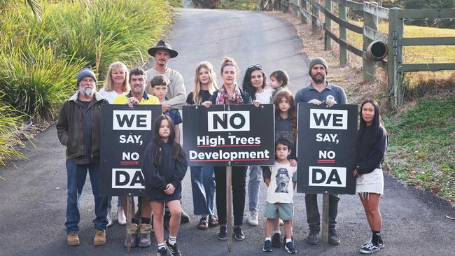 Spokesperson Kaylee Campradt and fellow Currumbin Valley neighbours and residents stand in the driveway for a new boutique school they are opposed to in the Hinterland suburb. High Trees Primary will be built in the Currumbin Valley and will be one of the first new schools built on the Coast in recent years. The group are opposing the school, arguing it is inappropriate for the area, will generate too much traffic and that there is a lack of necessary infrastructure. Picture Glenn Hampson