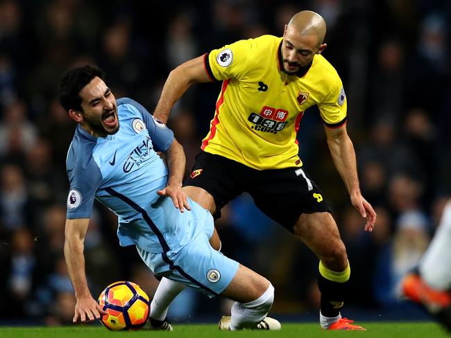 Ilkay Gundogan of Manchester City is challenged by Nordin Amrabat of Watford.