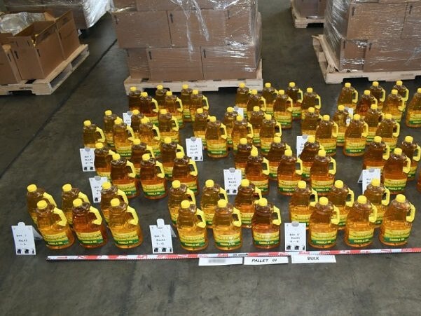 Investigations continuing after almost 540 kilograms of liquid methamphetamine were discovered concealed inside two shipping containers of 9360 canola oil bottles sent from Mexico to Melbourne. Picture: AFP