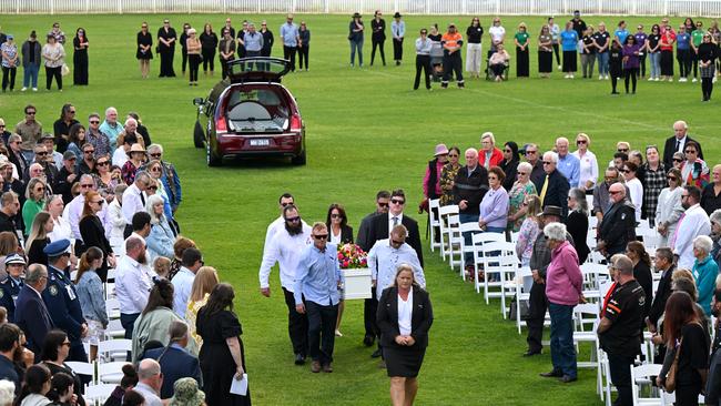 The casket arrives during a funeral service for Molly Ticehurst at Forbes Rugby Union Grounds. (AAP Image/Lukas Coch)