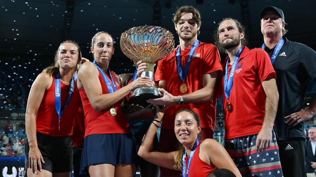 Team US celebrates with the winning trophy of the United Cup. Picture: AFP