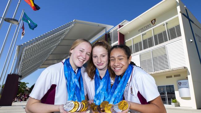 St Peters Lutheran College students Ella Ramsay, Mollie O'Callaghan and Claveria Johnson pose for a photograph at the school last year. (AAP Image/Renae Droop)