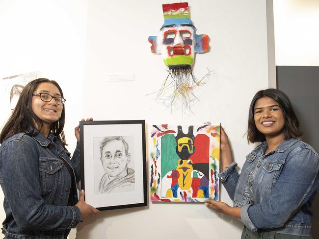 Broadmeadows students Latisha, 19 and Hansani, 21 with their artworks. Picture: Ellen Smith