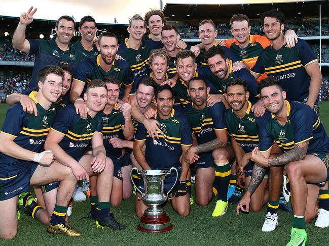 The victorious Australian team pose with the Cormac McAnallen trophy after winning the 2017 series. Picture: Getty Images