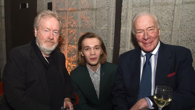Director Ridley Scott with actors Charlie Plummer and Christopher Plummer.