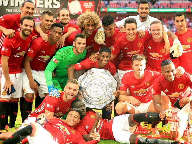 Manchester United team pose for a photo with the Community Shield.