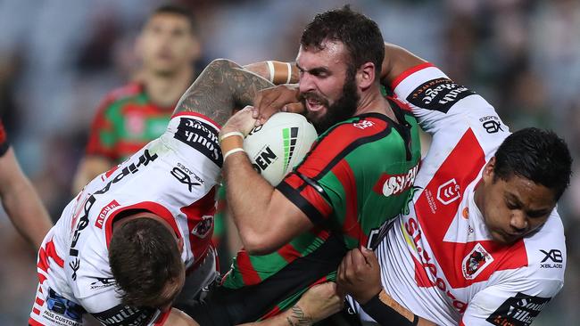 Mark Nicholls is tackled during the match against St George last season. Pic: Brett Costello