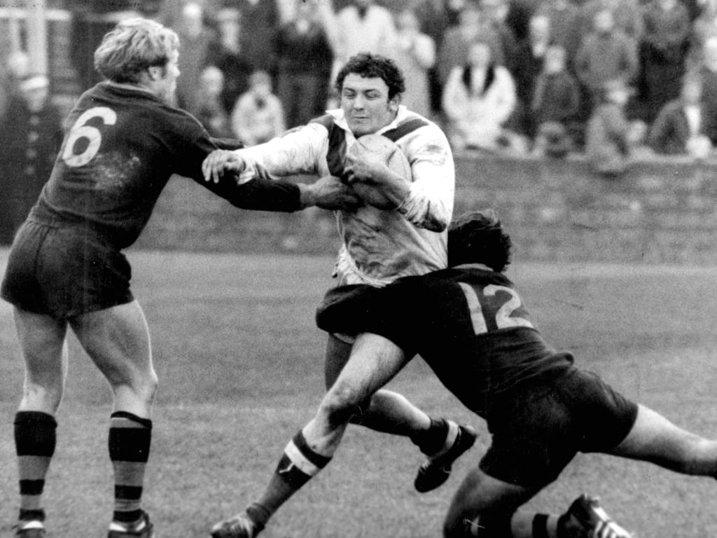 Doug Laughton is tackled by Bob Fulton (L) and Ron Costello during the Australia v Great Britain World Cup final in Leeds, England in 1970.