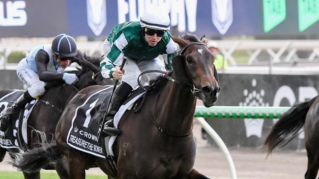 Treasurethe Moment and Damian Lane power away to win the VRC Oaks at Flemington. Picture: Pat Scala/Racing Photos via Getty Images