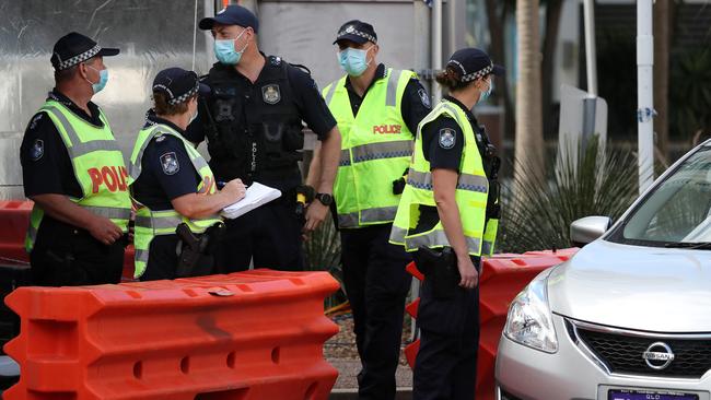 Police in Griffith Street, Coolangatta at the Queensland and New South Wales border checkpoint. Picture: NIGEL HALLETT