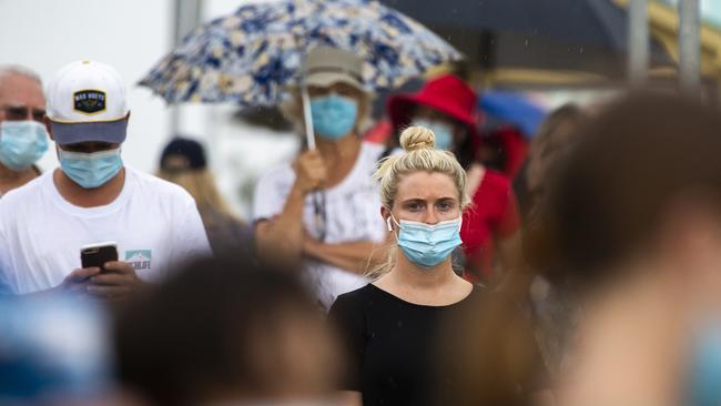 People line up outside a testing centre at Mona Vale Hospital on Friday as the northern beaches cluster grows. Picture: Jenny Evans/Getty Images