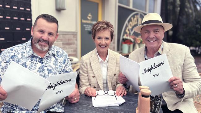 Ryan Moloney, Jackie Woodburne and Alan Fletcher with Neighbours scripts for 2023 after the show was revived. Picture: Supplied