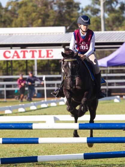 Hayley Wall and Black Layce at the PQC State Showjumping Championships 2023.