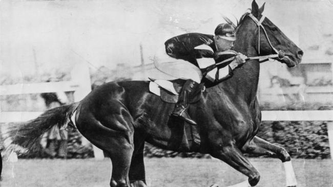 Phar Lap being ridden by jockey Jim Pike.