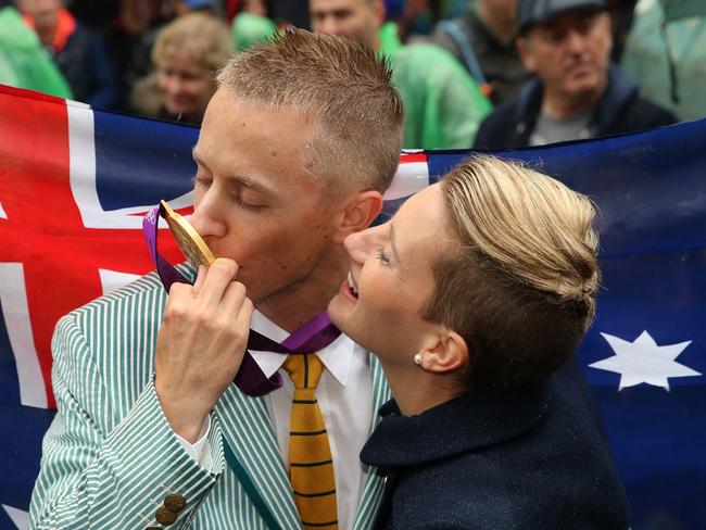 Jared Tallent presented with his Gold Medal for the 50km Walk for the 2012 London Olympic Games, on the steps of Treasury buildings in Melbourne. Picture: Alex Coppel.