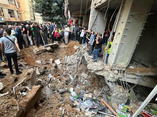 People check the damage at the scene of an Israeli strike in Beirut's southern suburbs on September 20. Picture: Anwar Amro/AFP