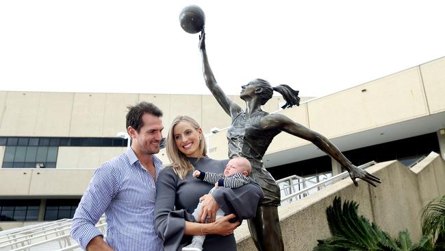 Champion netballer Laura Geitz with husband Mark Gilbride and 11-week-old son Barney at the unveiling a life-size statue of her at Brisbane Entertainment Centre. Picture: Tara Croser.