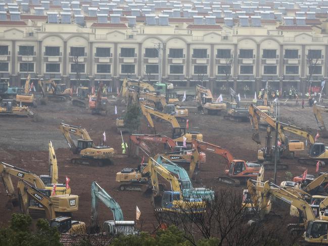 Workers are scrambling to build a 1000-bed field hospital in Wuhan, China, by February 3 to cope with the surge coronavirus patients in the city. Picture: Getty