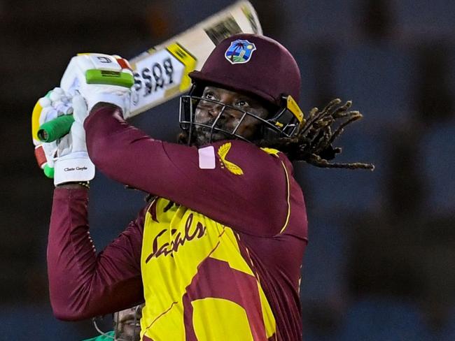 Chris Gayle of West Indies hits 6 during the 3rd T20I between Australia and West Indies at Darren Sammy Cricket Ground, Gros Islet, Saint Lucia, on July 12, 2021. (Photo by Randy Brooks / AFP)