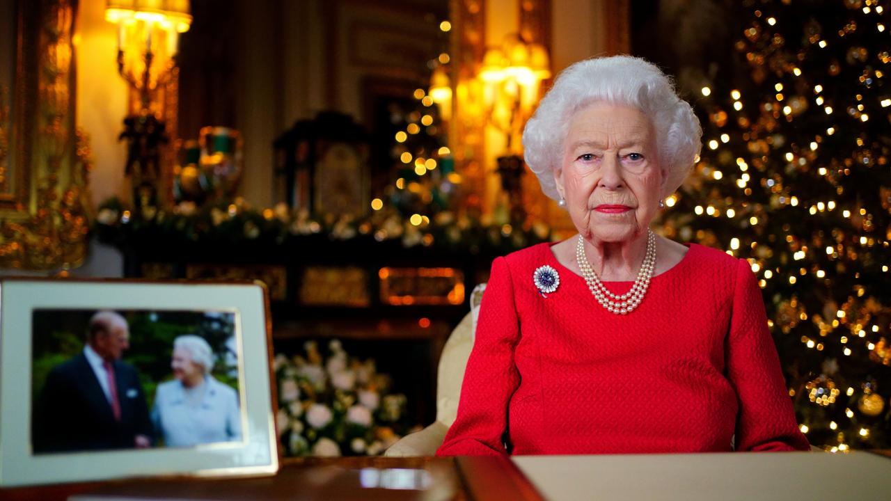 The Queen sits alongside the anniversary photo and wears the treasured brooch while recording her Christmas Day speech. Picture: Victoria Jones – Pool/Getty Images