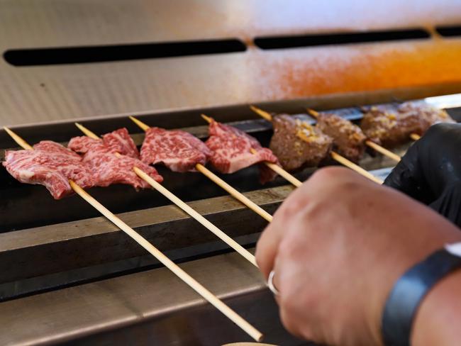 Wagyu skewers on the grill.