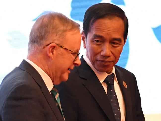 Australia's Prime Minister Anthony Albanese walks on stage with Indonesia's President Joko Widodo during the summit. Picture: AFP