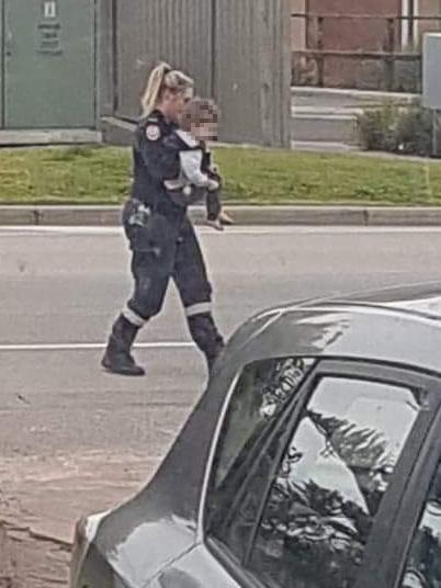 An older child being removed from the scene by a paramedic at Langwarrin. Picture: Supplied