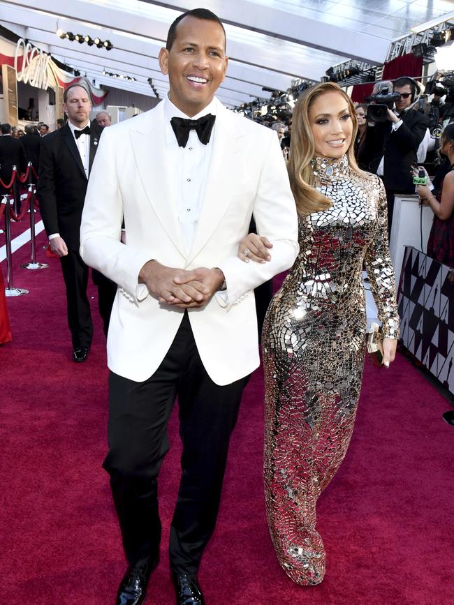 Couple alert! Alex Rodriguez, left, and Jennifer Lopez arrive at the Oscars. Picture: AP