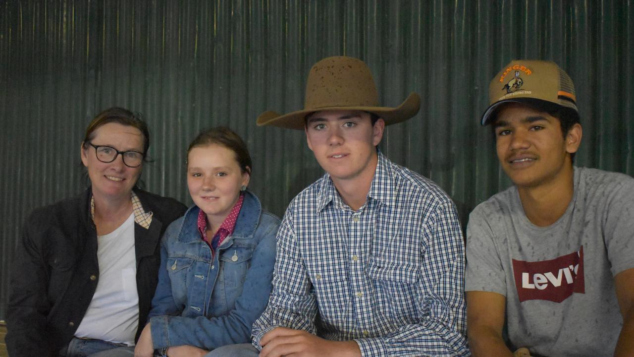 Fiona, Stef, and Will Turner with Kenny Jacks on the first night of the 2021 Warwick Rodeo.