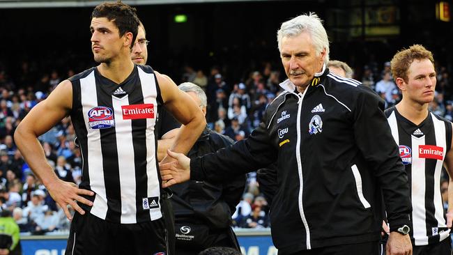 Mick Malthouse and Scott Pendlebury after the 2011 Grand Final loss.