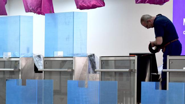 Glass shields at check-in counters. Picture: Elvis Barukcic/AFP