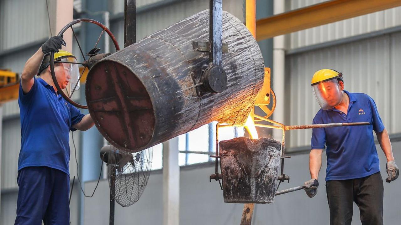 Chinese workers pouring molten steel at a factory in Fujian province. Picture: Agence France-Presse/Getty Images