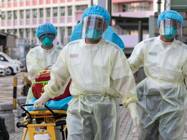 Medical staff in 2020 approaching a care home in Hong Kong, which has become epicentre of city’s latest outbreak. Picture: AFP.