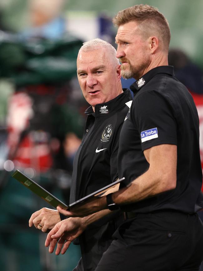 Graham Wright speaks to Nathan Buckley during a game. Picture: Michael Klein