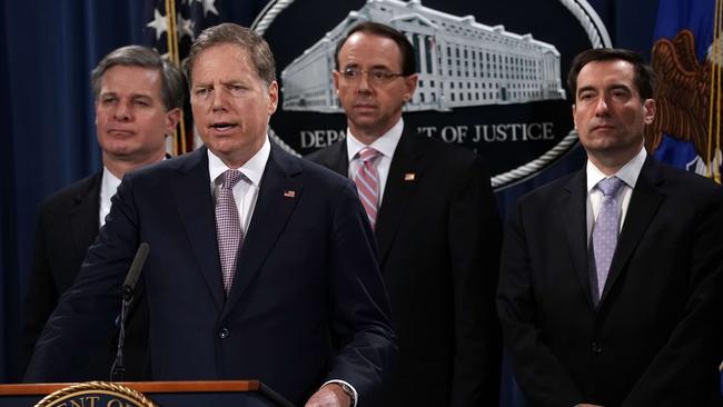 US Attorney for the Southern District of New York Geoffrey Berman (2nd L) speaks as (L-R) FBI Director Christopher Wray, US Deputy Attorney-General Rod Rosenstein and Assistant Attorney-General for National Security John Demersat a news conference over the spies. Picture: AFP. 