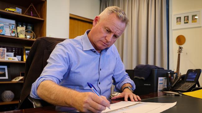 Tasmanian Premier Jeremy Rockliff looks over plans for the urban renewal project at Regatta Point next to Macquarie Point.