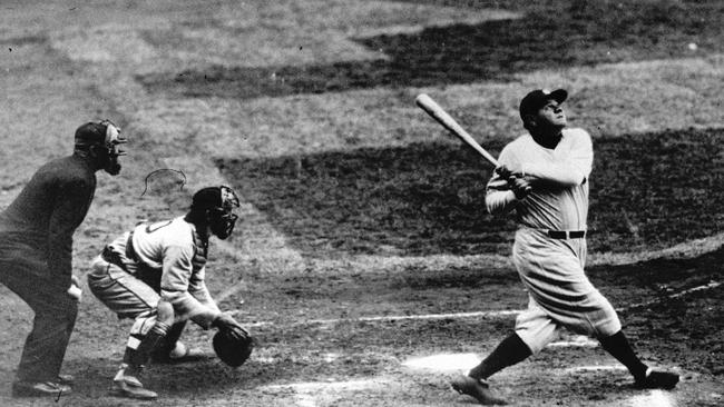New York Yankees' Babe Ruth clouts a towering home run in this undated photo. Baseball A/CT Historical