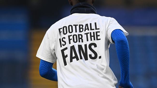 Brighton & Hove Albion players warm up by sending a message of protest. Picture: Neil Hall / Getty Images
