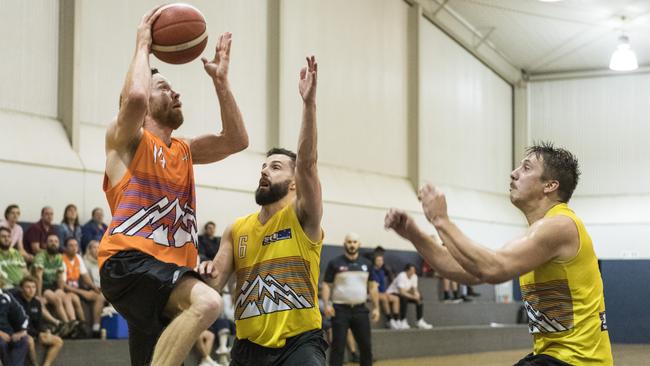 James Lymer (left) shoots for Westridge Fruit and Veg Warriors under pressure from Robert Ashford (centre) and Jason Ebneter of Southern Cross Bricklaying Eels. Picture: Kevin Farmer