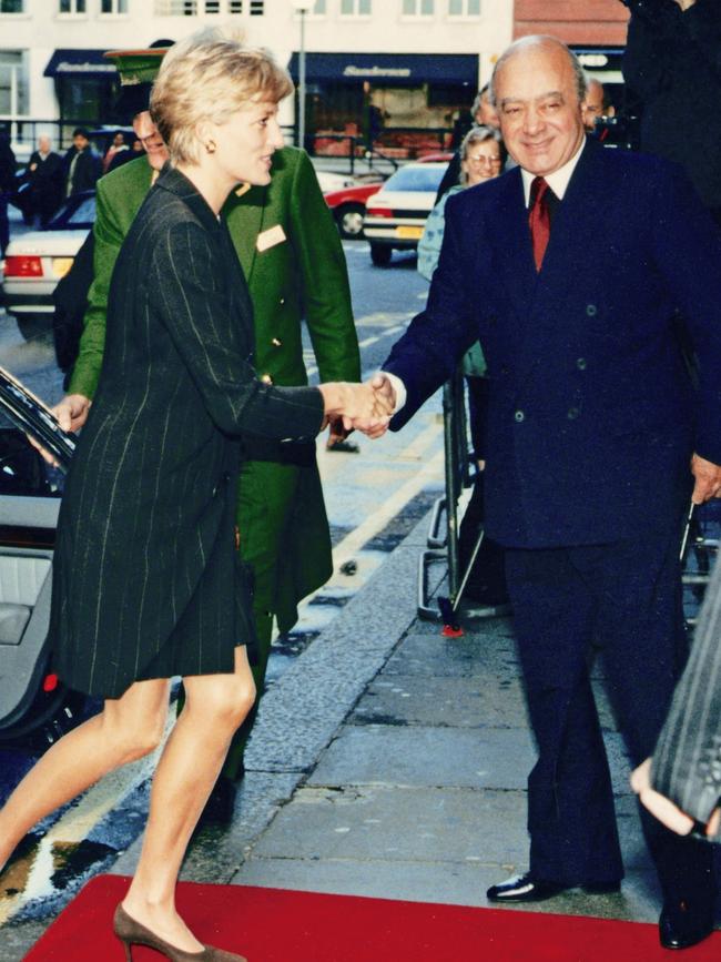 Diana meets Mohamed Al-Fayed at Harrods for a breakfast reception, as she attends the 'Heart of Britain' book launch. Picture: Mirrorpix/Getty Images