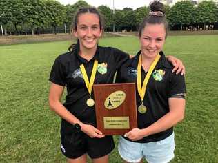 DYNAMIC DUO: Chloe Cocks (left) and Holly Anlezark celebrate their Paris World Games Rugby Sevens victory. The University Saints and West Bulldogs duo were part of the Tribe Rugby Sevens representative team that went through the competition undefeated. Picture: Contributed