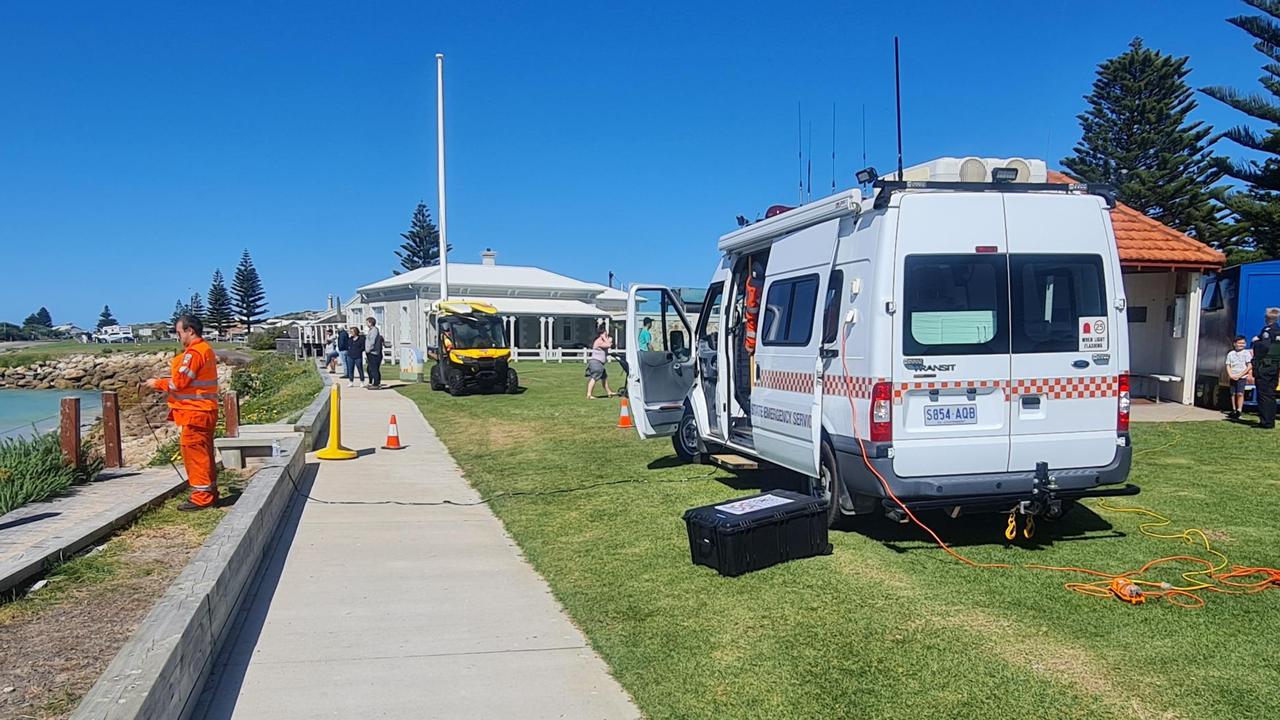 SES crew members search for the shark with a drone at Beachport Jetty on Monday afternoon. Picture: SES