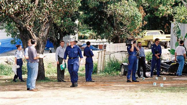 Police officers investigate the scene of a shoot-out between bikies at Cremorne on August 31st, 1997. Picture: Daily Mercury Archives