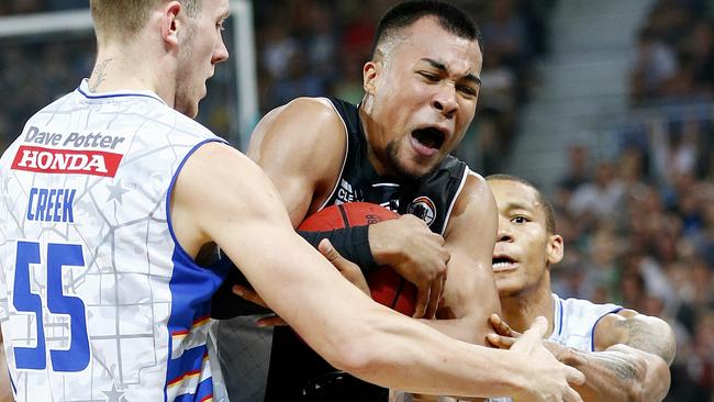 Stephen Holt fouled by Mitch Creek and Jerome Randle.