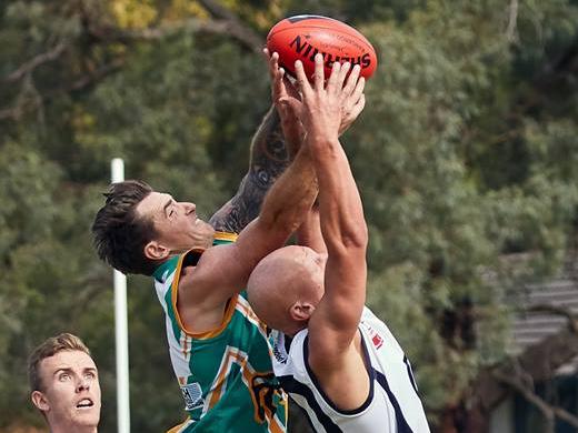 Aaron Mullett flies for a mark in his return game for Mooroolbark. Picture: Greg Hotker