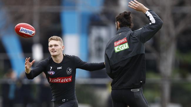 Adam Treloar, left, and Brodie Grundy at Collingwood training.